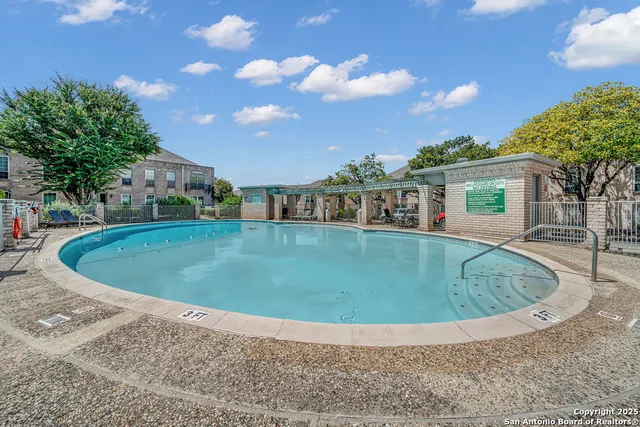 a view of a house with a backyard porch and sitting area