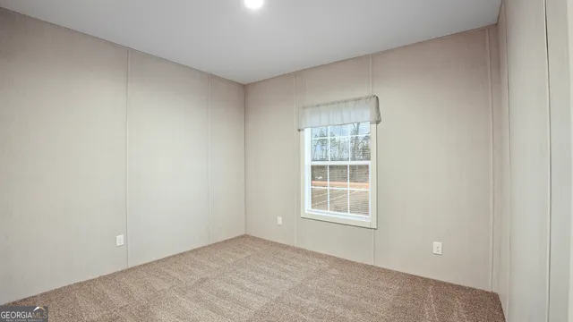 a bathroom with a granite countertop sink toilet a mirror and bathtub