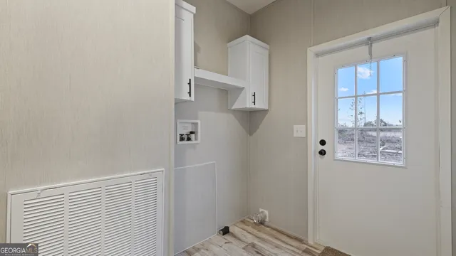 a view of a house with backyard and a patio