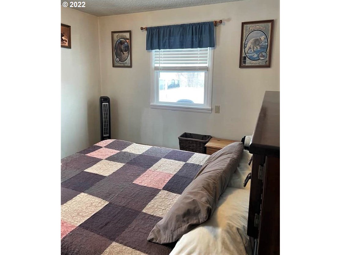 819 Southwest 7th Street Pendleton, OR 97801 - Photo 15 of 17 a bed room with a bed and a window