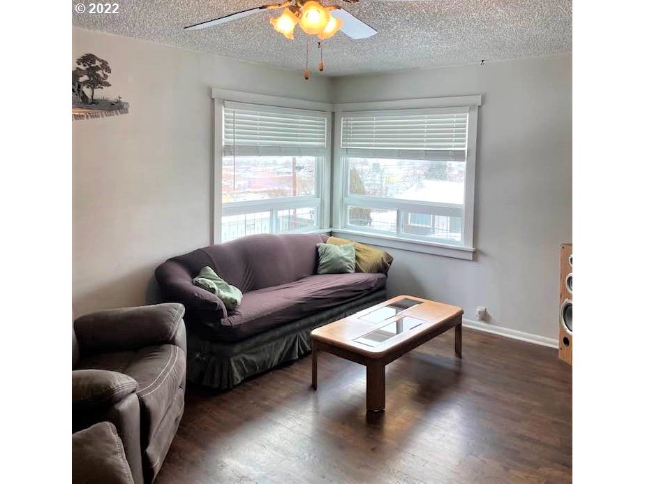 819 Southwest 7th Street Pendleton, OR 97801 - Photo 3 of 17 a living room with furniture a window and a chandelier
