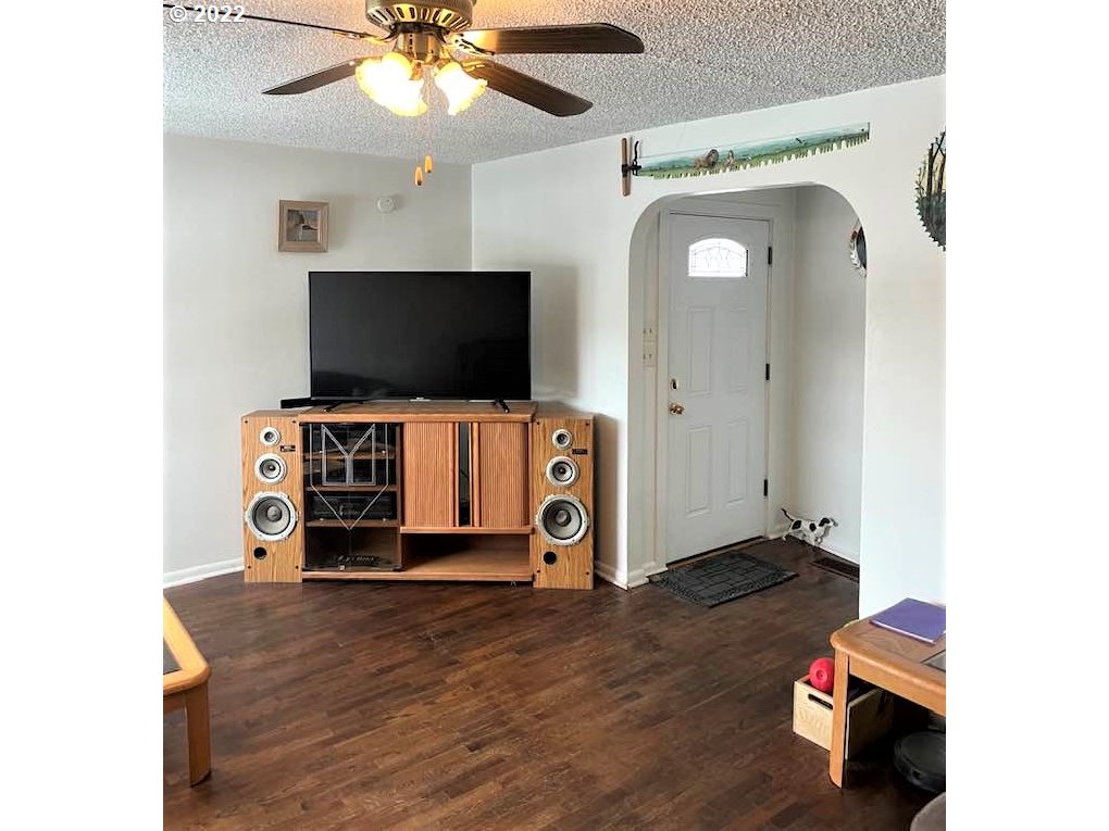 819 Southwest 7th Street Pendleton, OR 97801 - Photo 4 of 17 a living room with furniture and a flat screen tv
