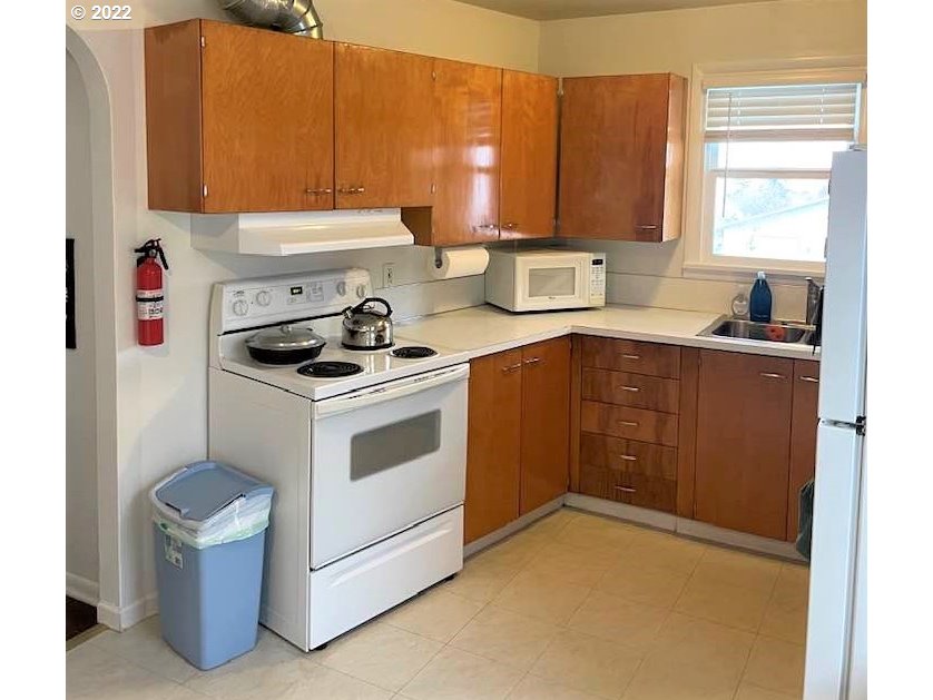 819 Southwest 7th Street Pendleton, OR 97801 - Photo 9 of 17 a kitchen with a stove cabinets and a sink