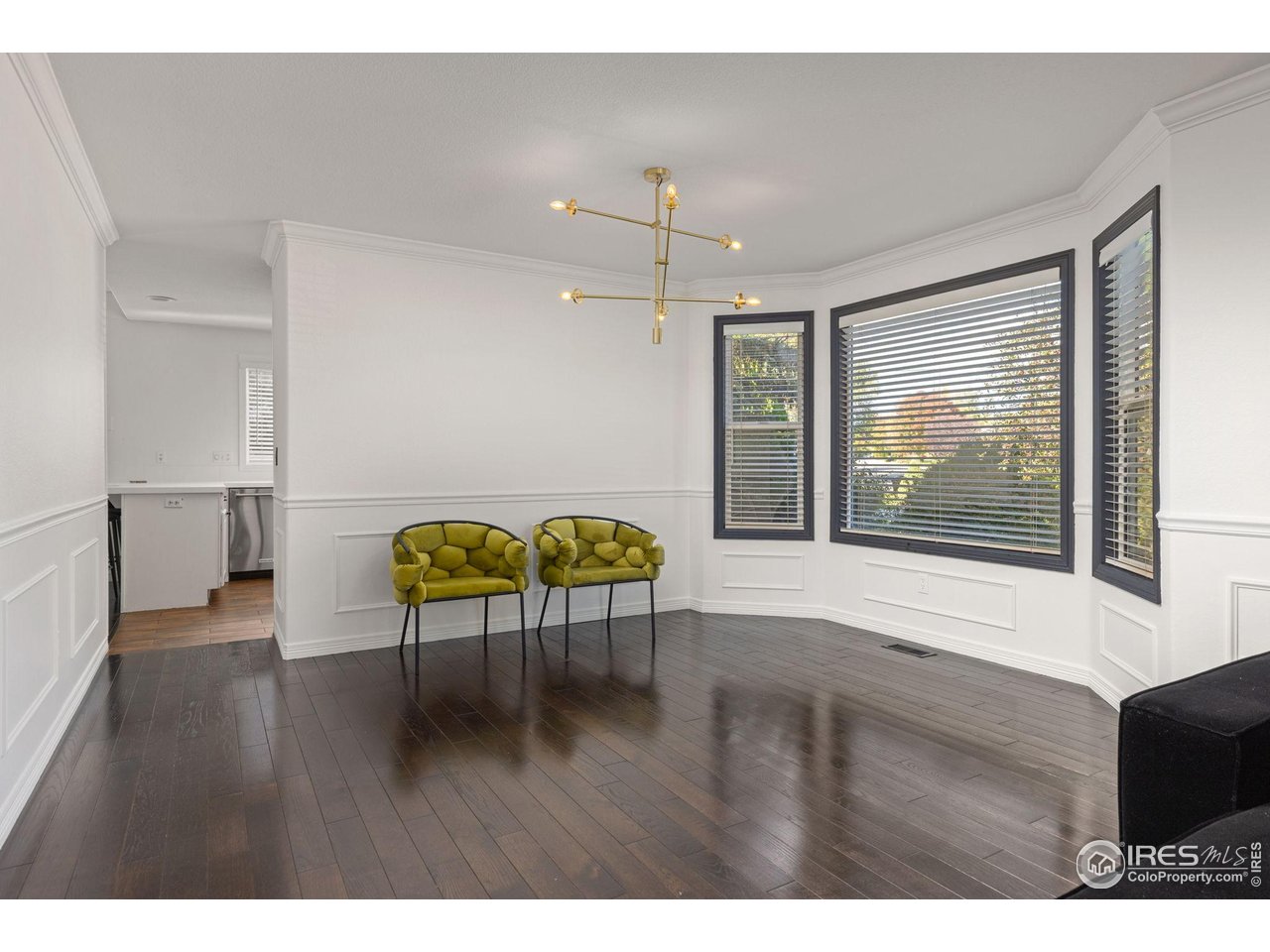 7271 Irwin Court Fort Collins, CO 80528 - Photo 12 of 49 a view of livingroom with furniture window and wooden floor