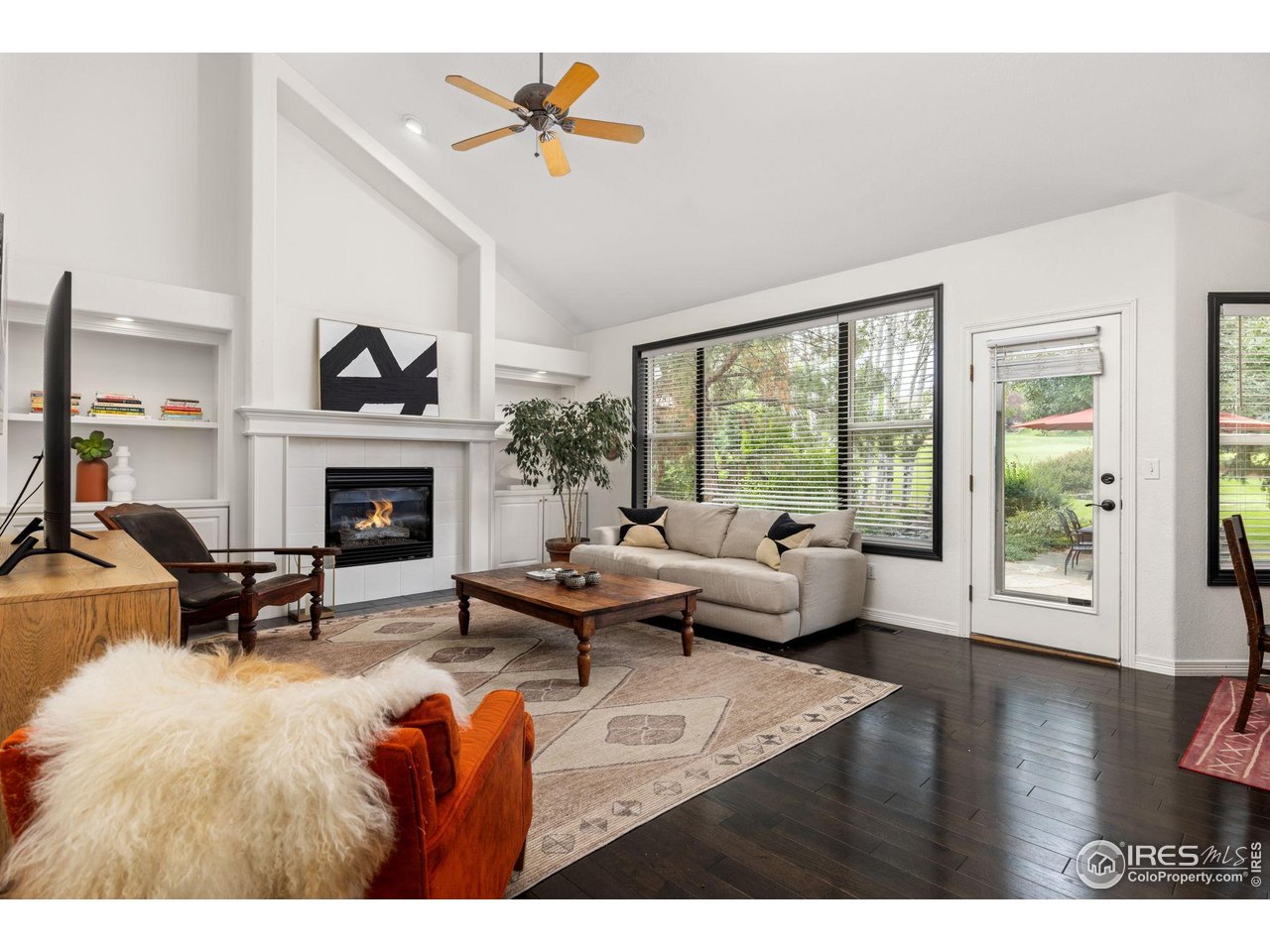 7271 Irwin Court Fort Collins, CO 80528 - Photo 19 of 49 a living room with furniture and a fireplace
