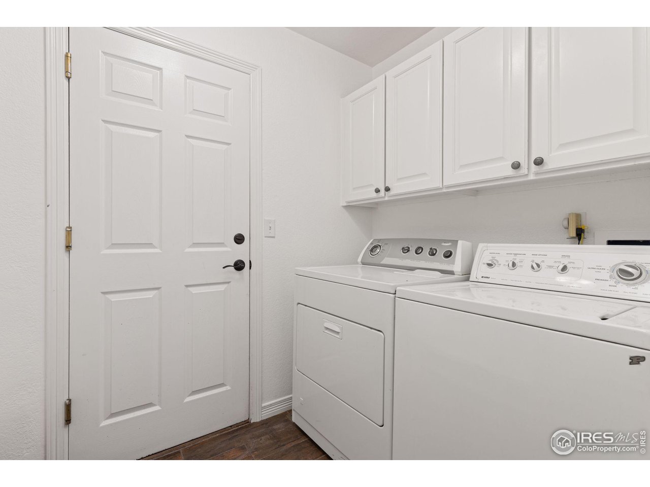7271 Irwin Court Fort Collins, CO 80528 - Photo 22 of 49 a utility room with closet dryer and washer