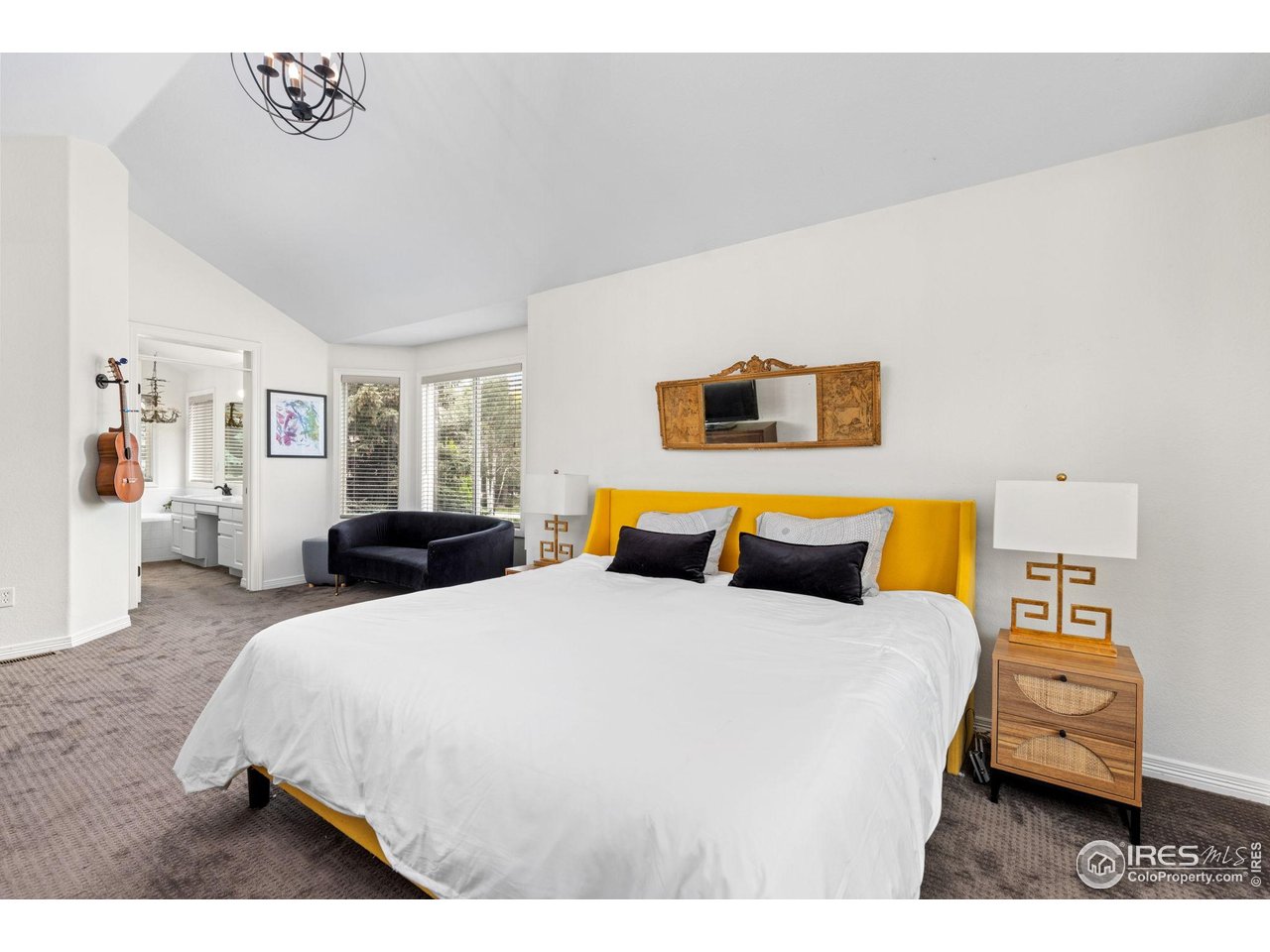 7271 Irwin Court Fort Collins, CO 80528 - Photo 25 of 49 a bedroom with a bed and wooden floor