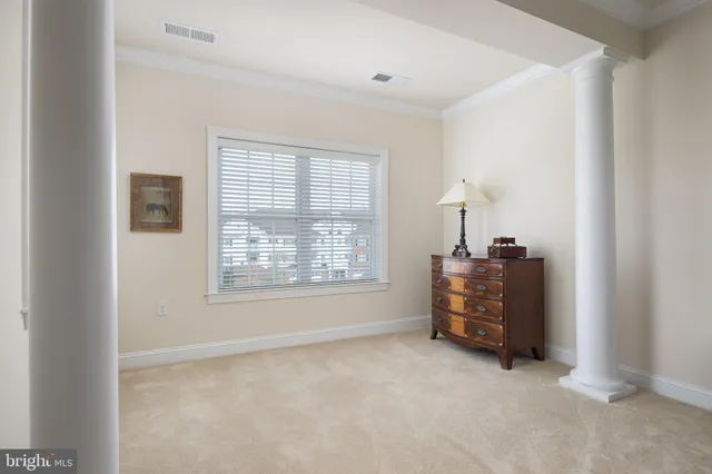 a room with a bed and a window