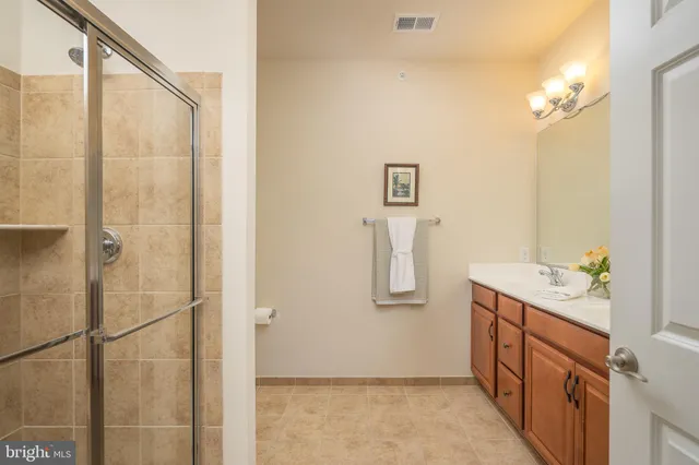 a bathroom with a sink and mirror