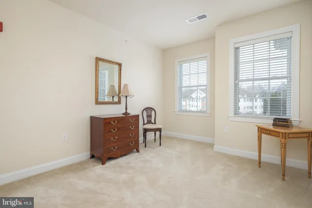 a view of workspace with furniture and window