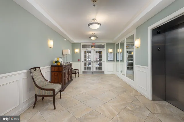 a view of a livingroom with furniture and a chair