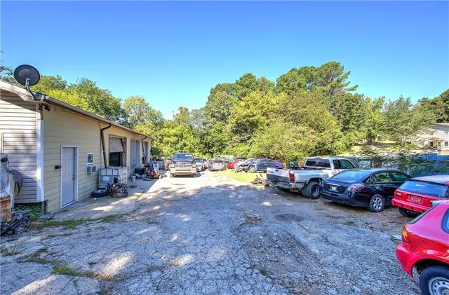 a view of a backyard with a car parked in it
