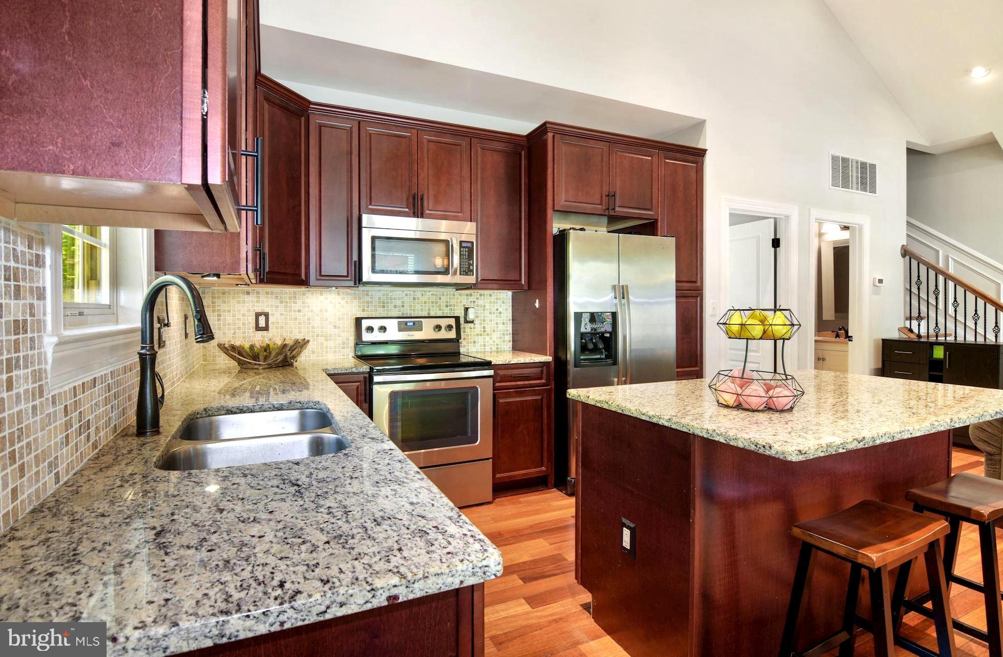 458 Riverside Drive Pasadena, MD 21122 - Photo 15 of 35 Mosaic Tile Backsplash . Rich Wood Cabinetry