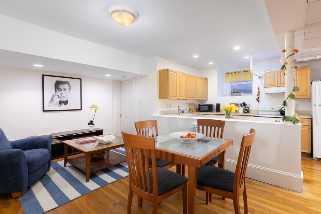 16 Garrison Road, Unit 7 Brookline, MA 02445 - Photo 2 of 9 a dining room with furniture and wooden floor