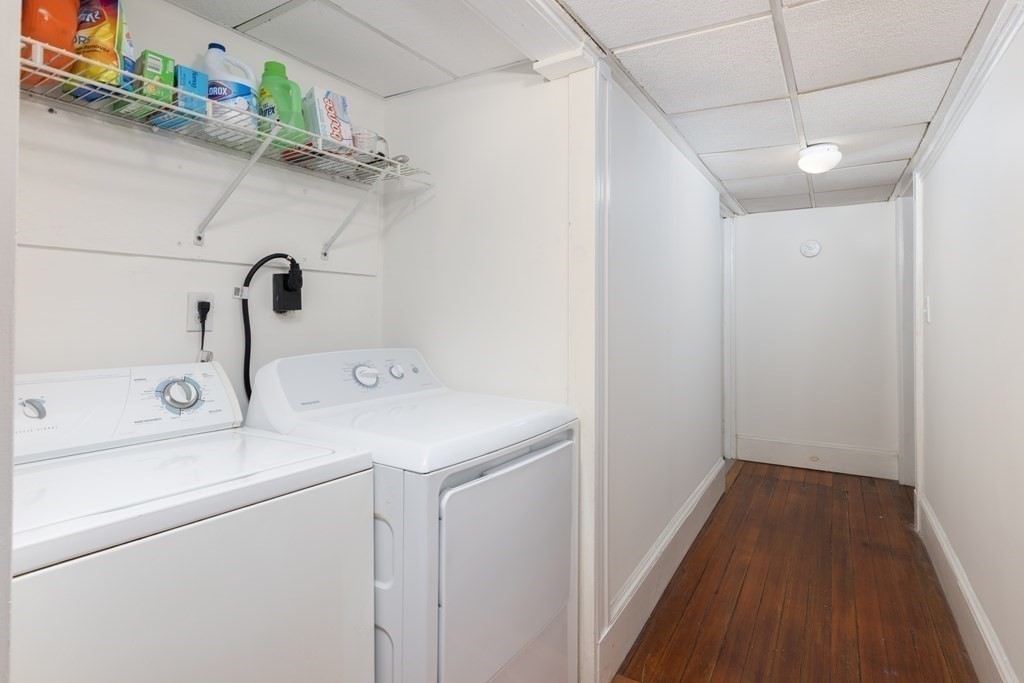 16 Garrison Road, Unit 7 Brookline, MA 02445 - Photo 9 of 9 a utility room with dryer and washer