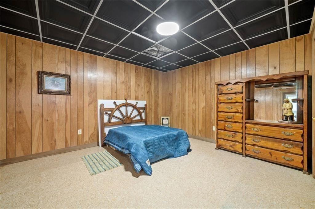 286 Hilton Way Canton, GA 30114 - Photo 41 of 59 a bedroom with a bed and a mirror