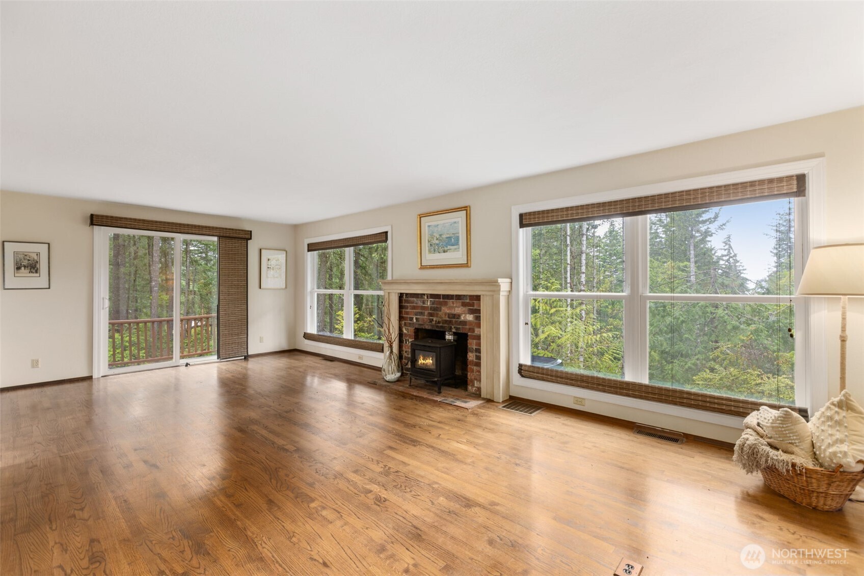 100 East Twanoh Heights Road South Belfair, WA 98528 - Photo 5 of 40 a view of an empty room with window and fire place