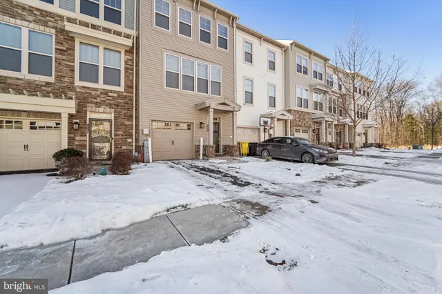 a view of a building with a snow on the road