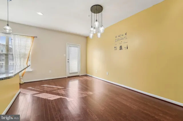 a view of a livingroom with wooden floor