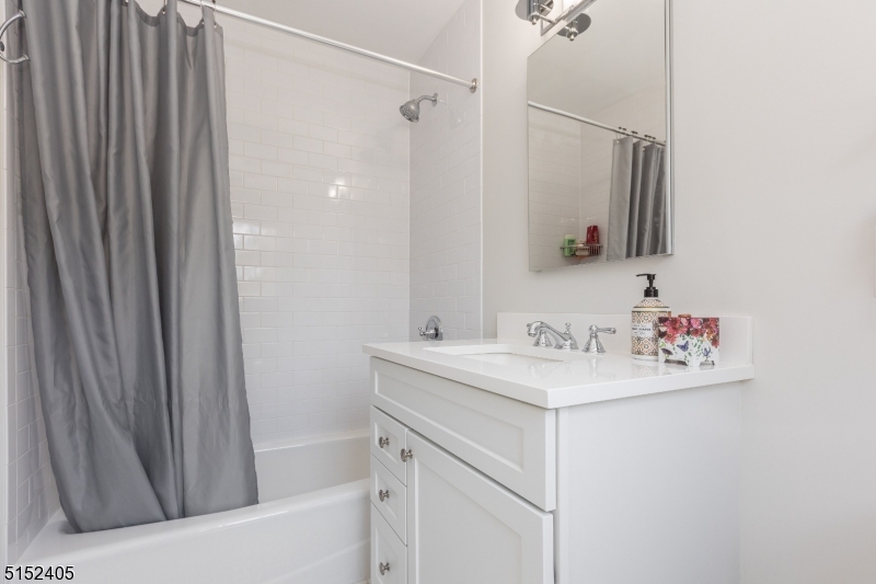 429 Green Village Road, Unit 2 Green Village, NJ 07935 - Photo 18 of 26 a bathroom with a sink vanity and a mirror