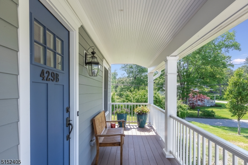 429 Green Village Road, Unit 2 Green Village, NJ 07935 - Photo 3 of 26 a view of roof deck with wooden floor and outdoor seating