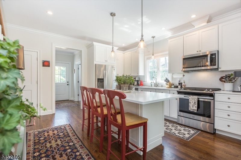 429 Green Village Road, Unit 2 Green Village, NJ 07935 - Photo 9 of 26 a kitchen with stainless steel appliances kitchen island granite countertop a stove a sink and a refrigerator