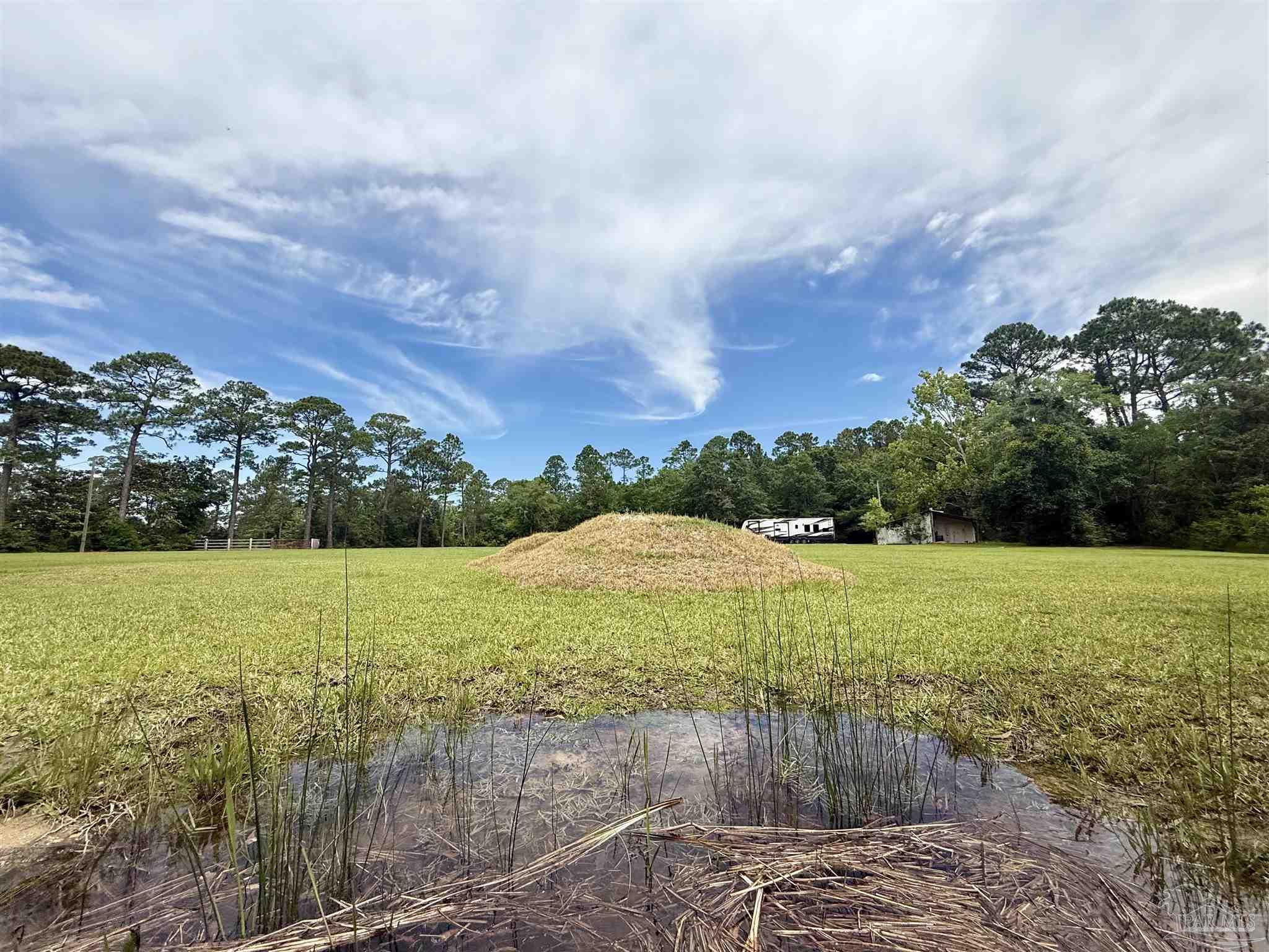 7524 Petersen Point Road Milton, FL 32583 - Photo 12 of 26 a view of an outdoor space and a yard