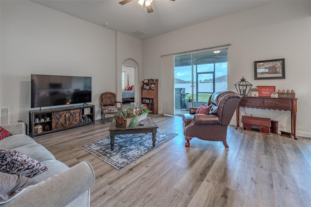 9224 Southwest 60th Ct Road Ocala, FL 34476 - Photo 2 of 55 a living room with furniture and a flat screen tv