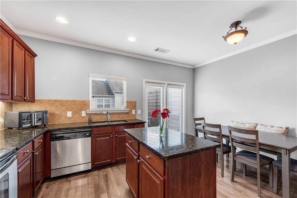 3039 Liberty Way Northwest Atlanta, GA 30318 - Photo 13 of 43 a kitchen with a sink stove and cabinets