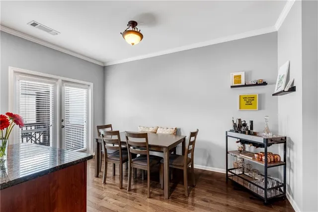 a view of a dining room with furniture and window