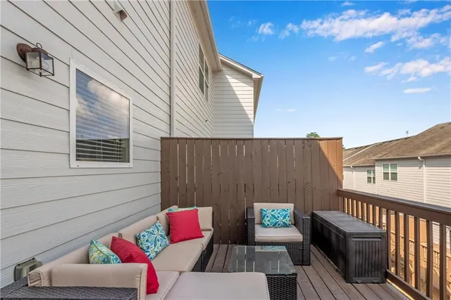 a view of balcony with wooden floor