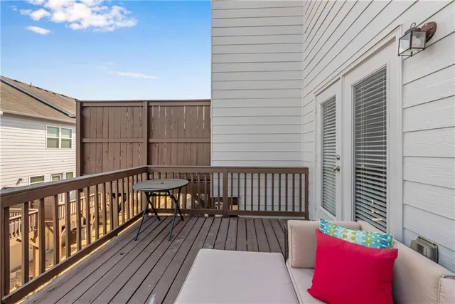 a view of a balcony with furniture