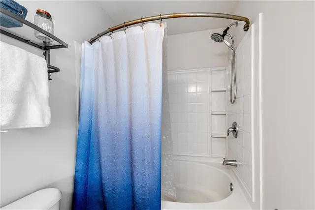 a work room with furniture and a flat screen tv