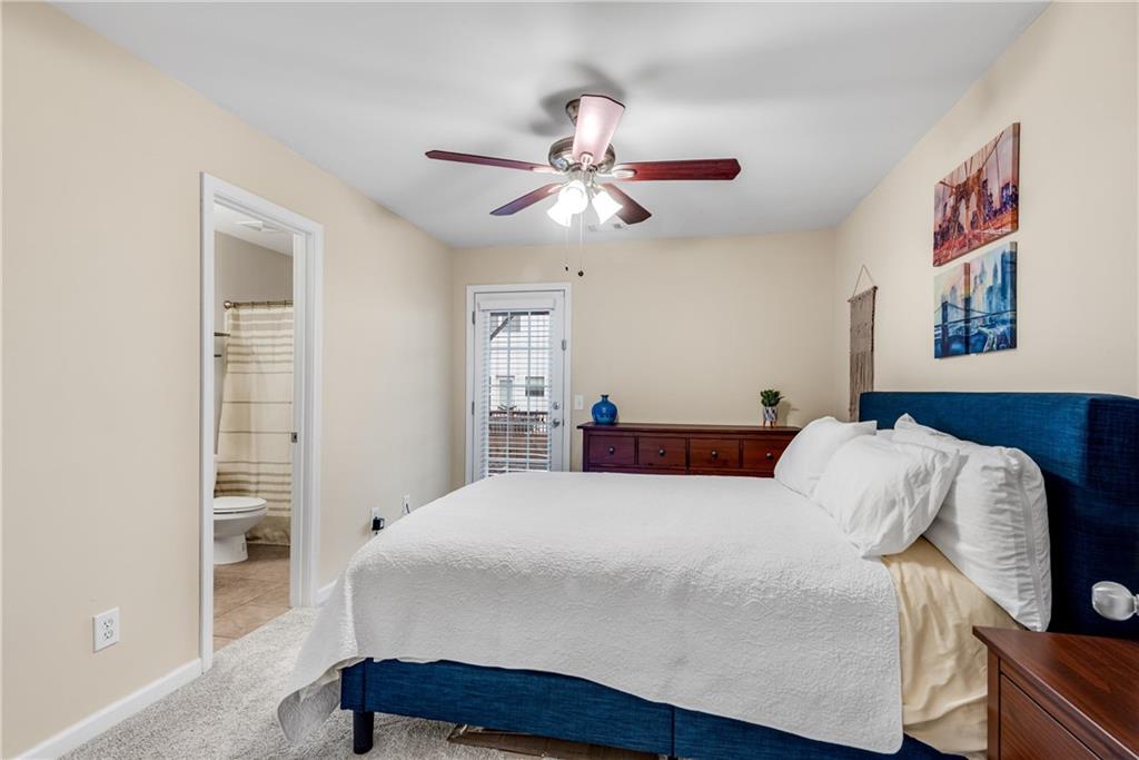 3039 Liberty Way Northwest Atlanta, GA 30318 - Photo 33 of 43 a bedroom with a bed and a chandelier