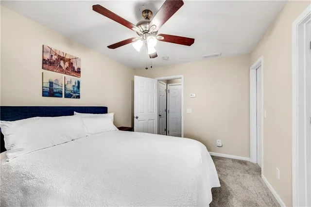 a view of a house with a backyard