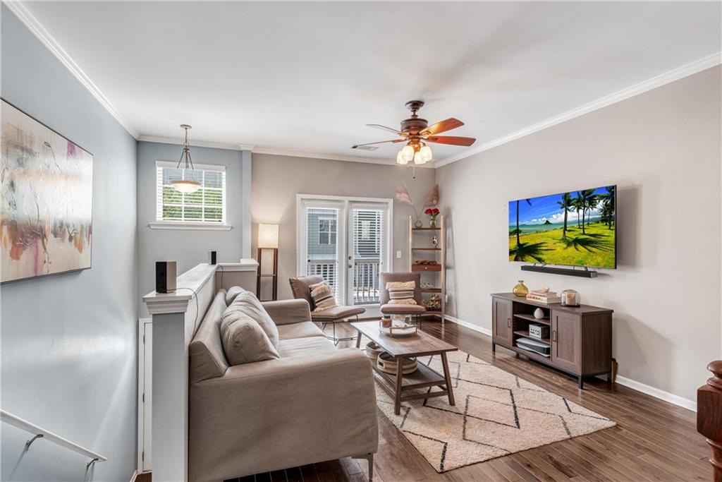 3039 Liberty Way Northwest Atlanta, GA 30318 - Photo 6 of 43 a living room with furniture a flat screen tv and kitchen view