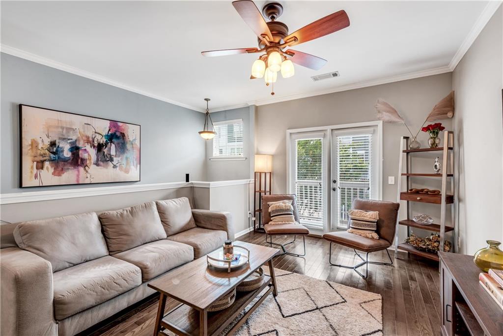 3039 Liberty Way Northwest Atlanta, GA 30318 - Photo 7 of 43 a living room with furniture a flat screen tv and a large window