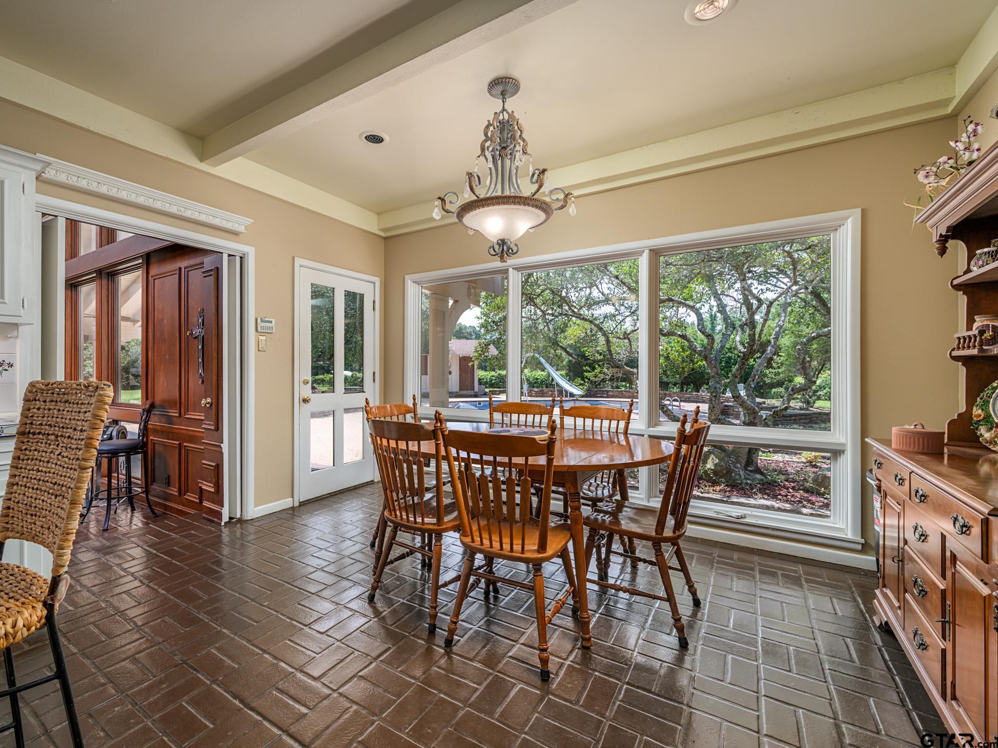 16611 Old Noonday Road Tyler, TX 75703 - Photo 11 of 46 a view of a dining room with furniture window and wooden floor