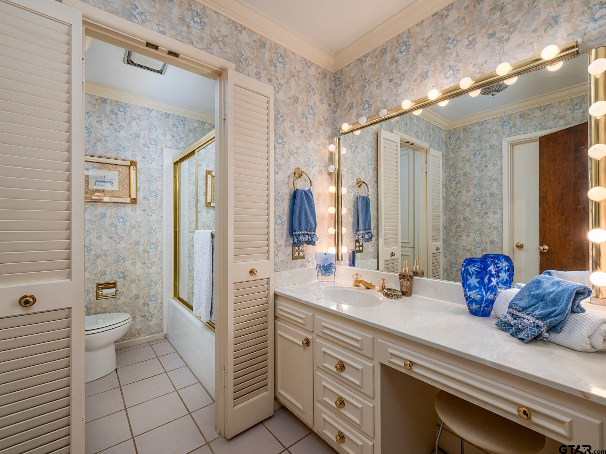 16611 Old Noonday Road Tyler, TX 75703 - Photo 20 of 46 a bathroom with a sink a toilet and shower