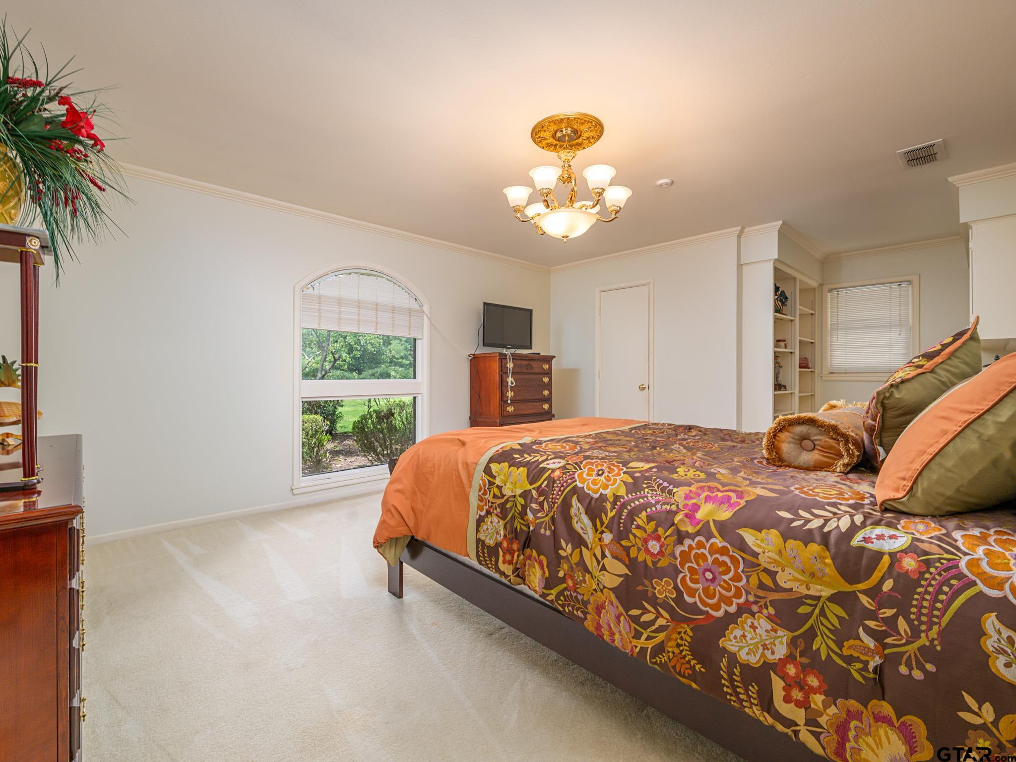 16611 Old Noonday Road Tyler, TX 75703 - Photo 24 of 46 a bed sitting in a bedroom next to a window