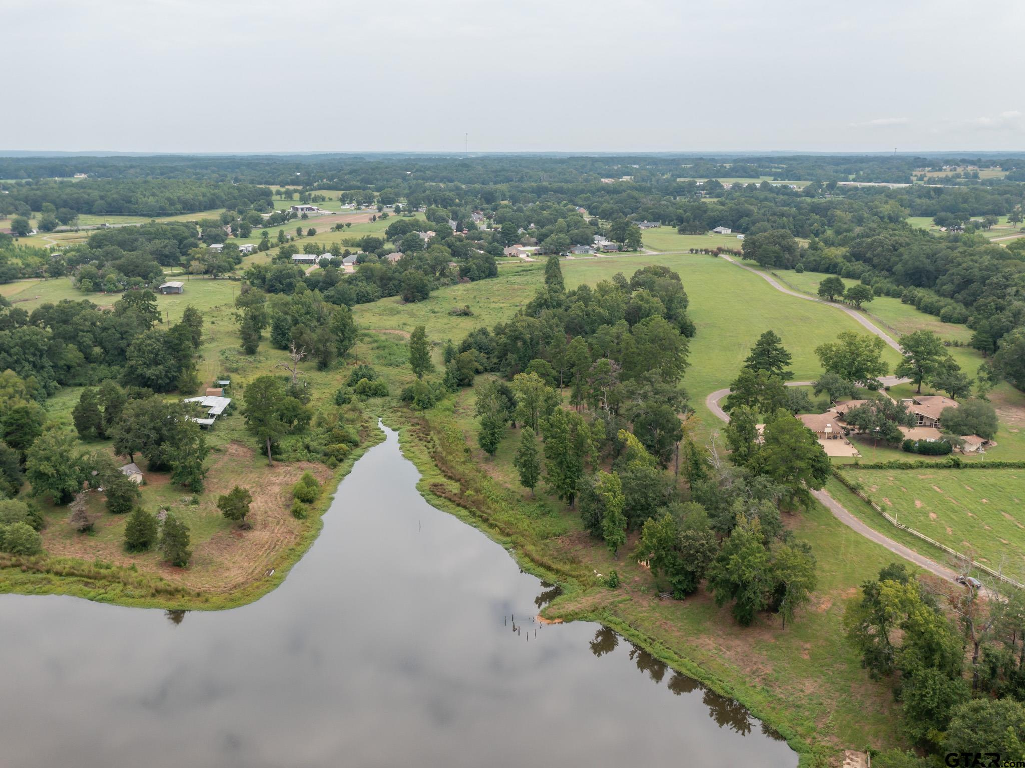 16611 Old Noonday Road Tyler, TX 75703 - Photo 36 of 46 an aerial view of residential houses with outdoor space and river