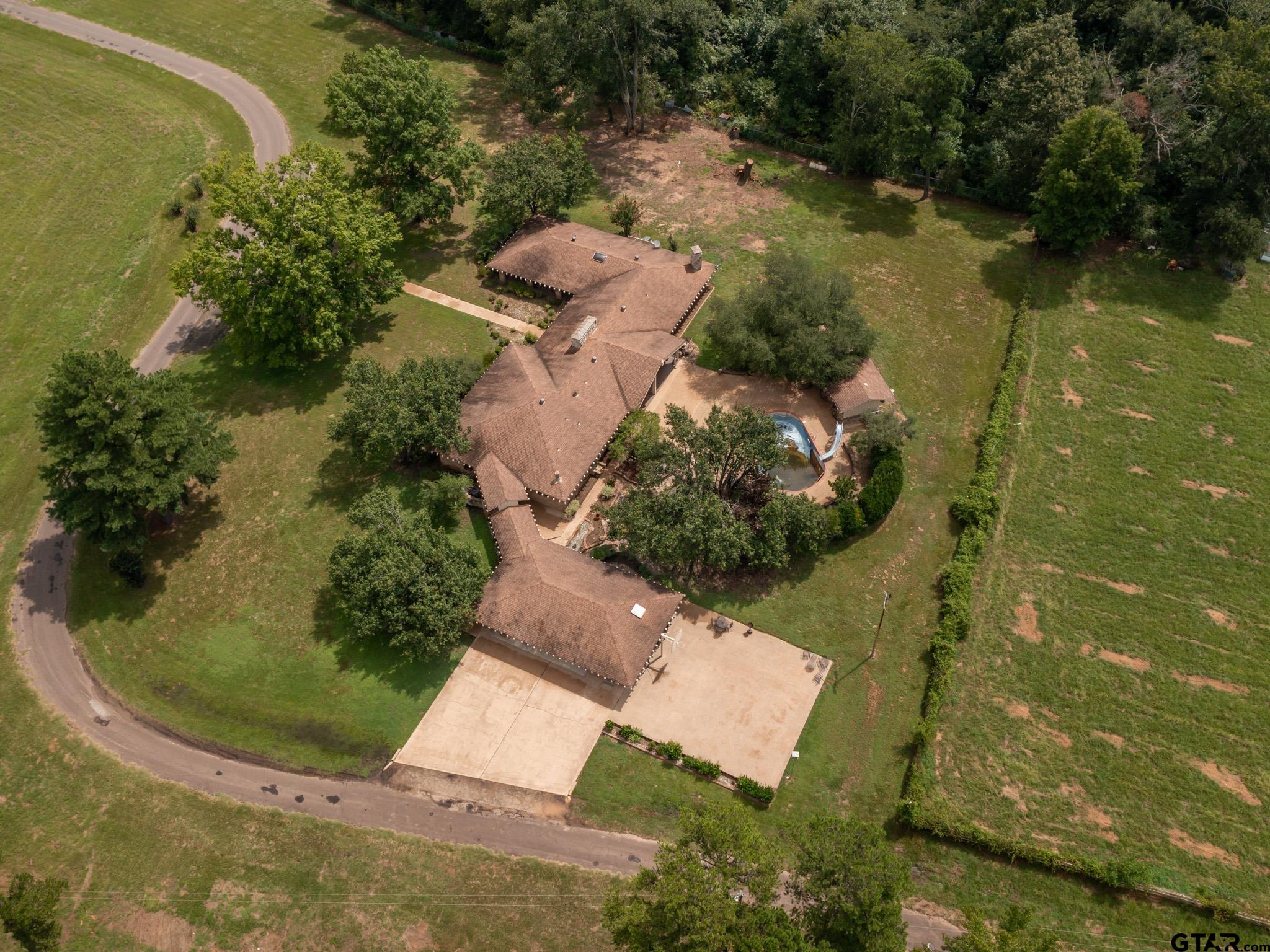 16611 Old Noonday Road Tyler, TX 75703 - Photo 43 of 46 an aerial view of residential house with outdoor space and swimming pool