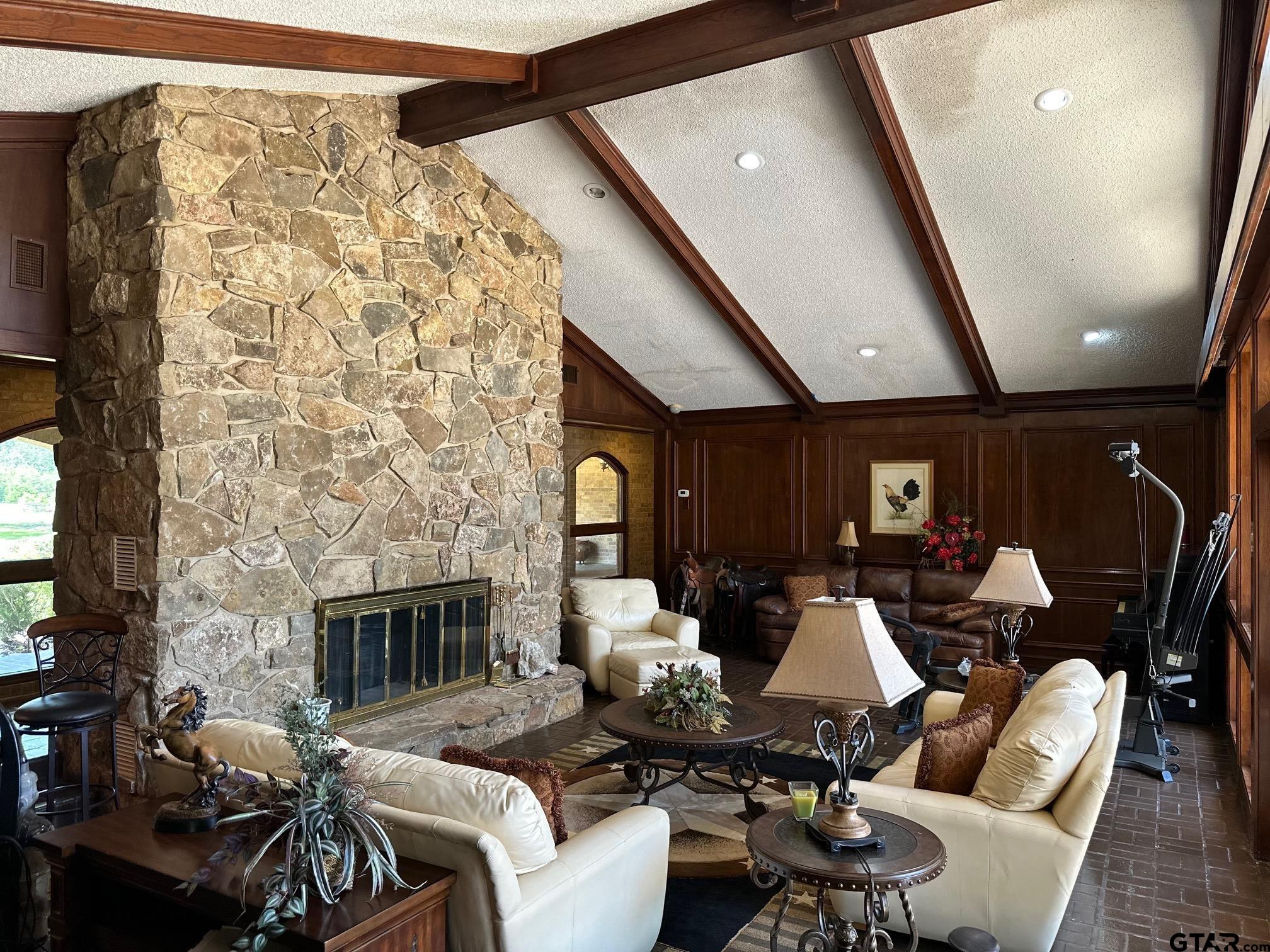 16611 Old Noonday Road Tyler, TX 75703 - Photo 6 of 46 a living room with furniture and a fireplace