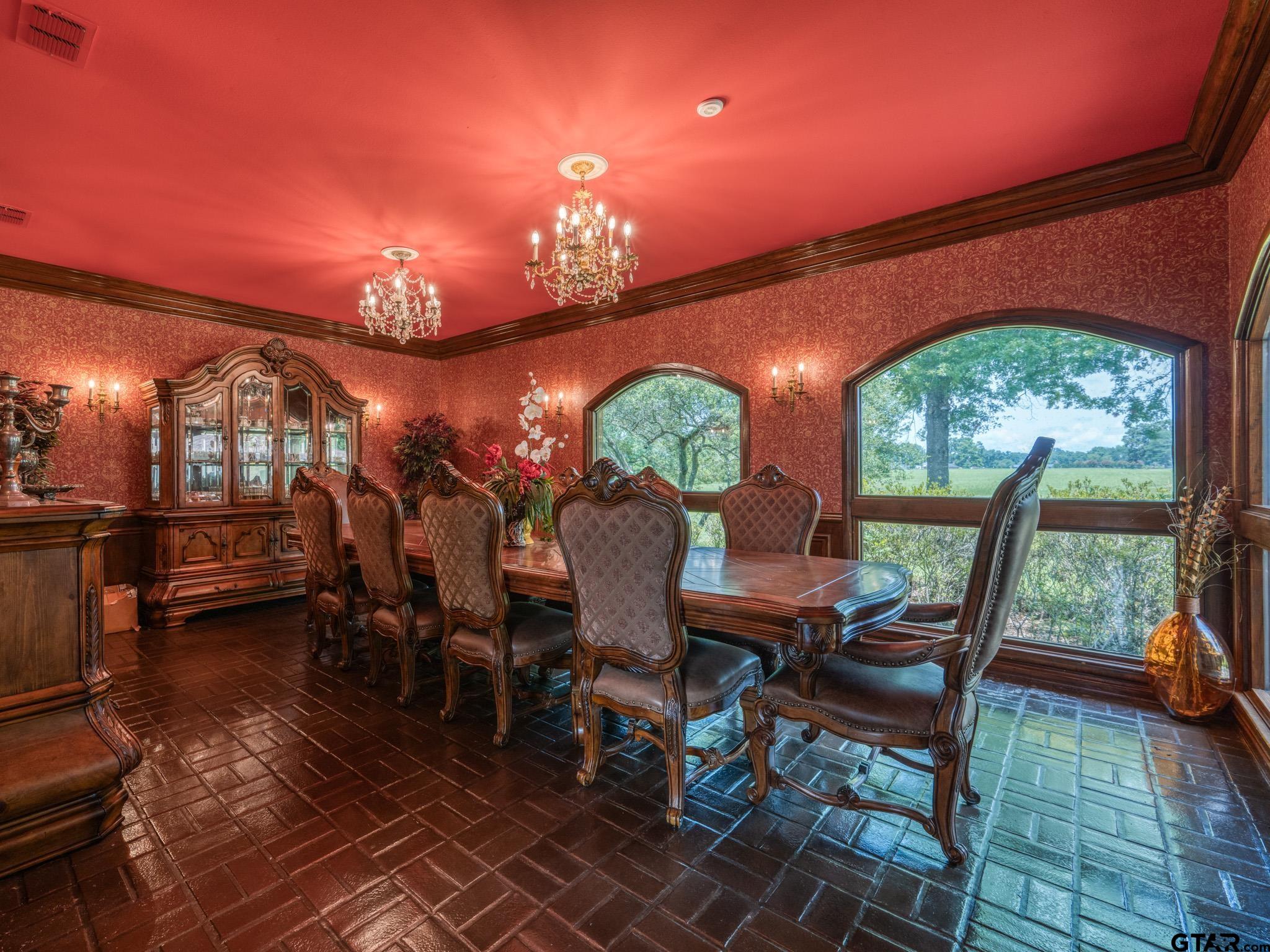 16611 Old Noonday Road Tyler, TX 75703 - Photo 8 of 46 a view of a dining room with furniture a chandelier and wooden floor