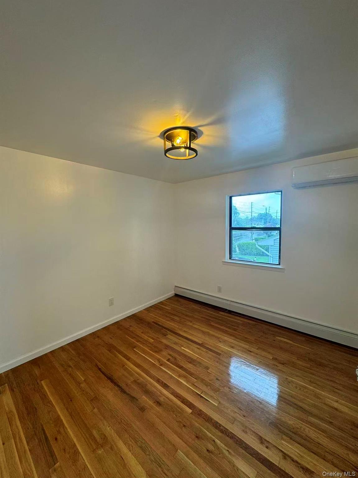 376 Newbridge Road East Meadow, NY 11554 - Photo 6 of 7 wooden floor in a room