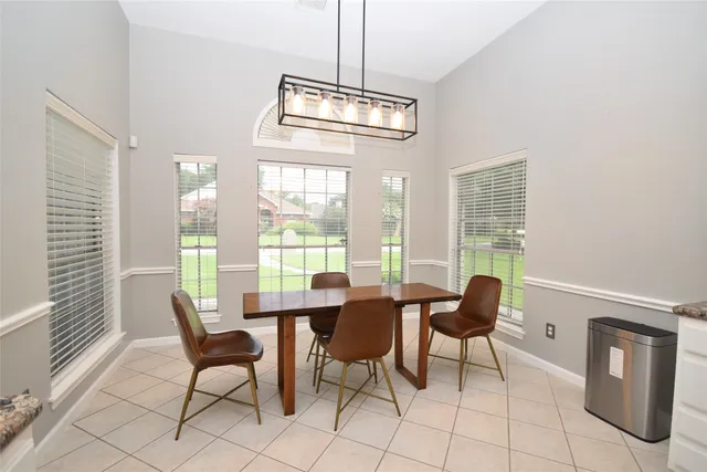 a bedroom with a bed and a refrigerator