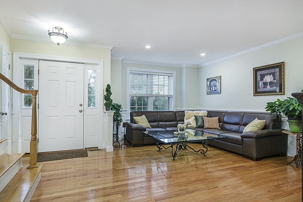 6 Robinson Road, Unit 16 Lexington, MA 02420 - Photo 3 of 20 a living room with furniture and wooden floor