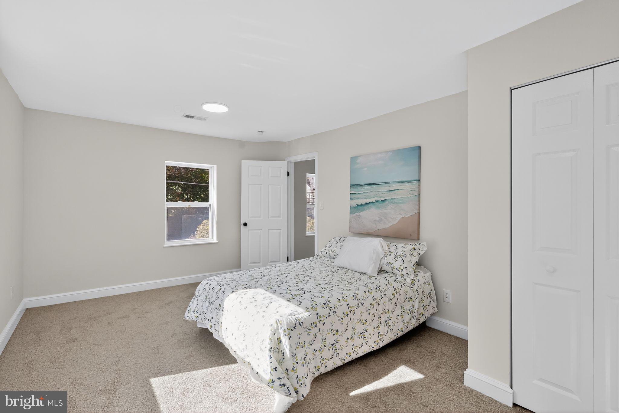 4508 Yates Road Beltsville, MD 20705 - Photo 12 of 25 a bedroom with a large bed and a window