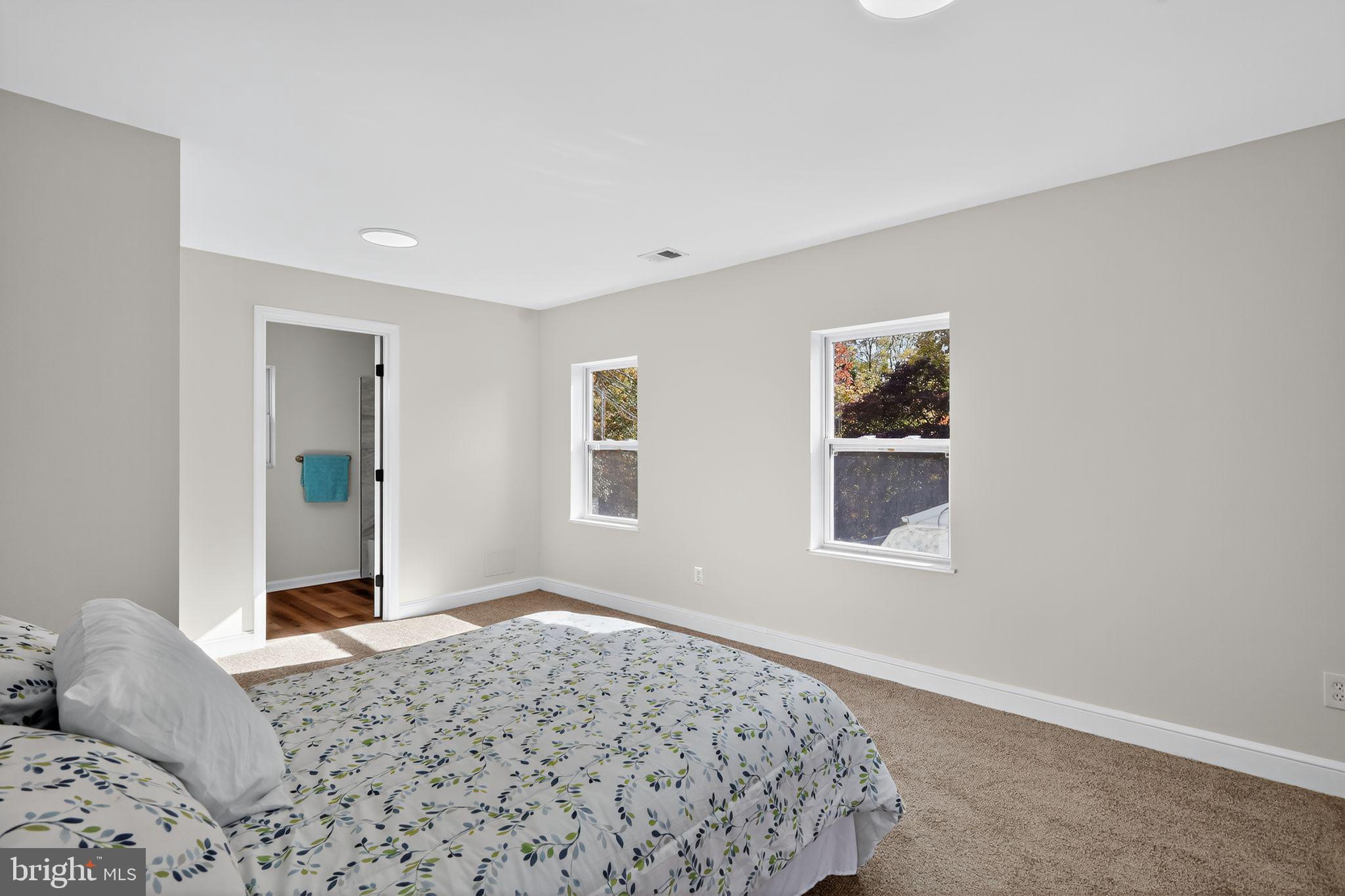 4508 Yates Road Beltsville, MD 20705 - Photo 13 of 25 a bedroom with a bed and a window