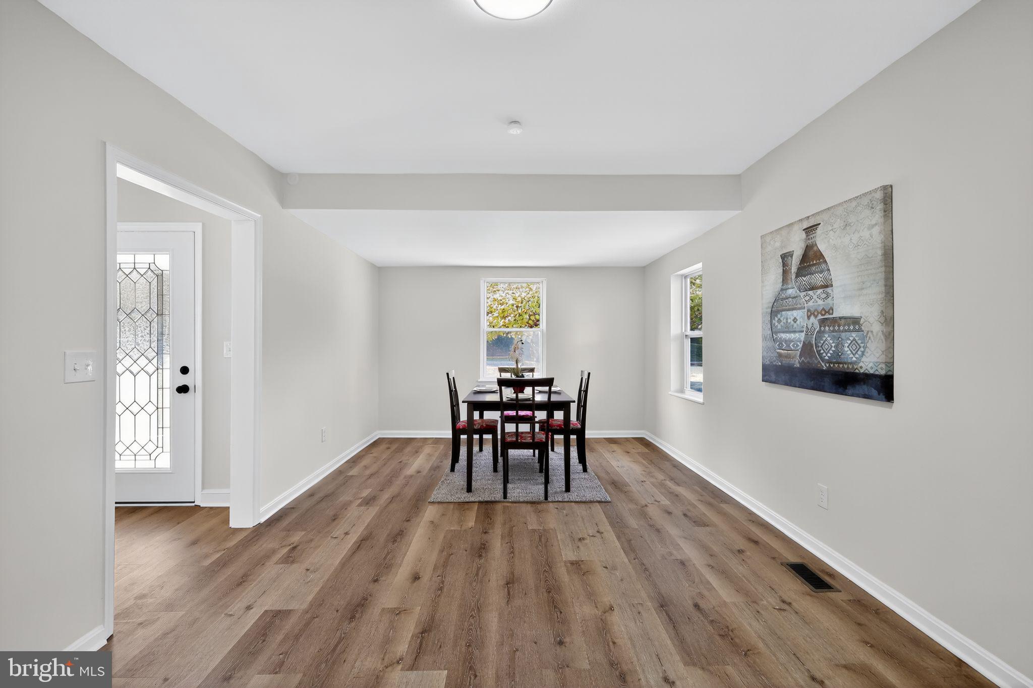 4508 Yates Road Beltsville, MD 20705 - Photo 8 of 25 a view of a livingroom with furniture and wooden floor